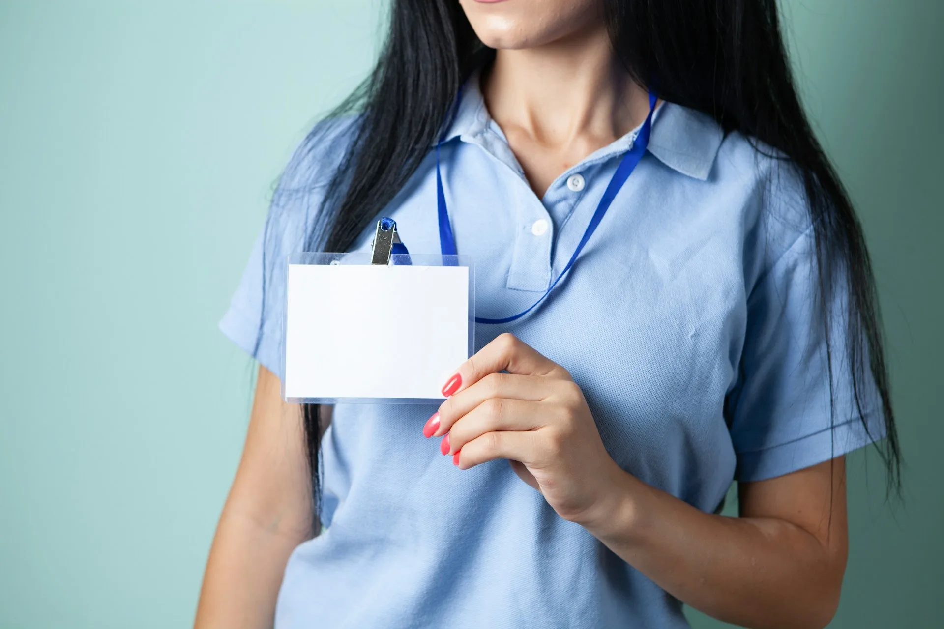 woman holding lanyard